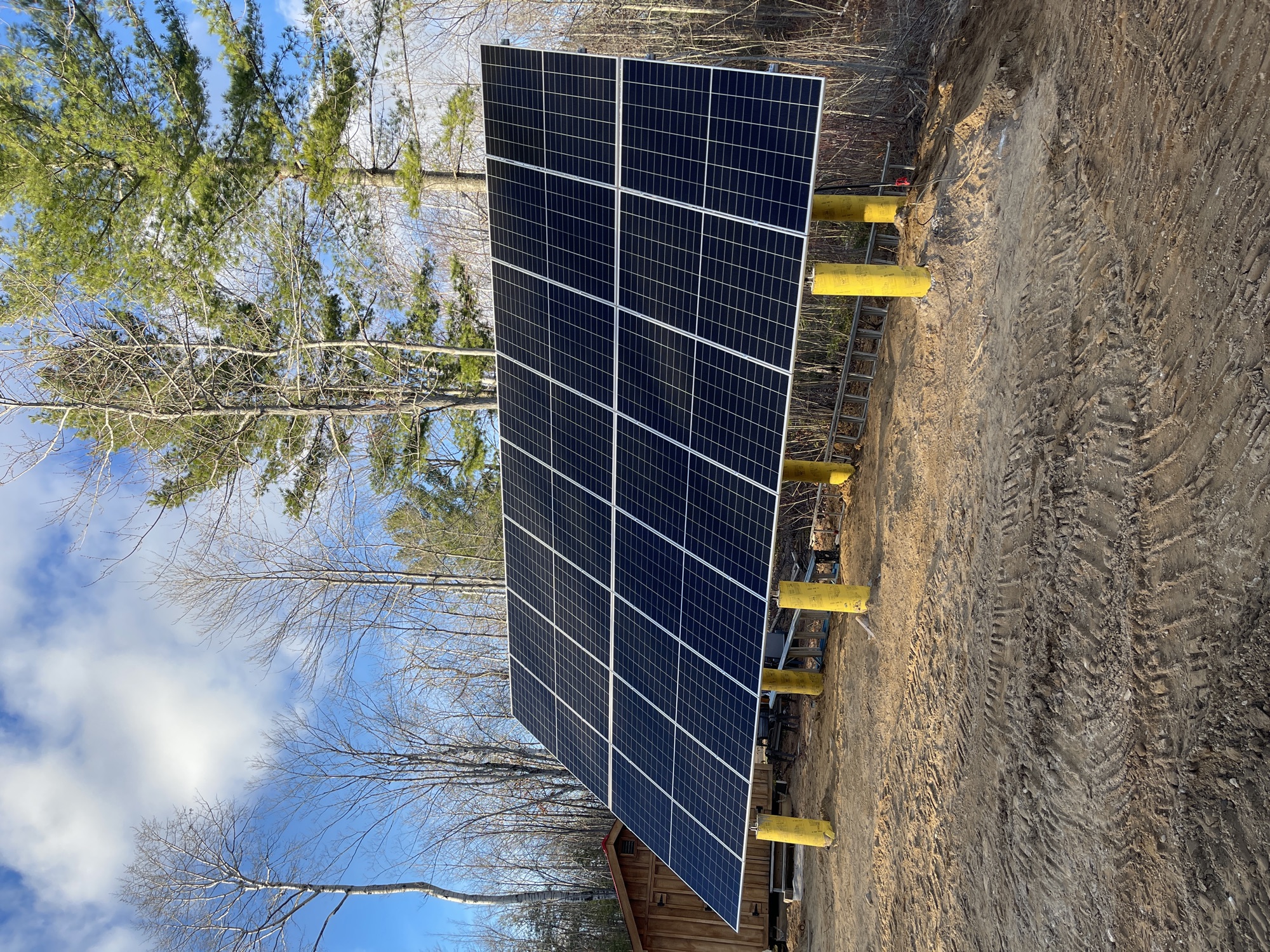 Soul-R ground-mounted solar array supported by yellow foundation posts in Algoma